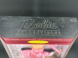 barbie doll in a box with a pink dress and pink hair