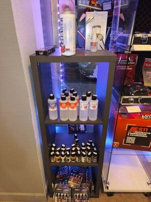 a display case filled with bottles of beer and other drinks
