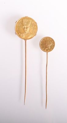 pair of gold plated earrings with a coin on a stick