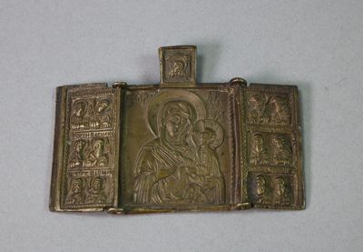 an image of a metal plaque with a picture of a woman on it