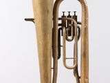 an image of a brass instrument hanging from the ceiling