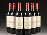 six bottles of red wine are lined up in a row