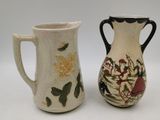 two vases sitting next to each other on a table