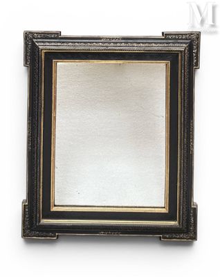 a close up of a mirror on a wall with a white background