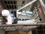 a basket full of household items sitting on the floor