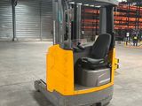 a fork lift truck parked inside of a warehouse