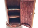 a wooden cabinet with a door open on a white background