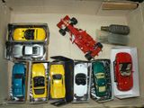 a lot of toy cars in a box on a table
