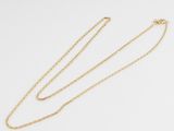 a gold chain necklace with a heart pendant on a white background