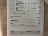 a paper with a tax form on it sitting on a table