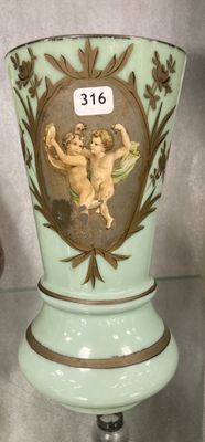 a vase with a picture of two cherensils on it