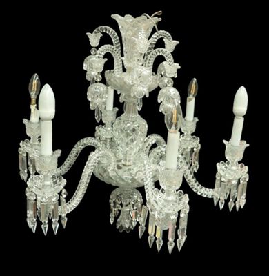 a crystal chandelier with five lights hanging from it