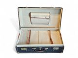an old suitcase with a bunch of papers inside of it