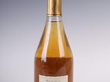 an image of a bottle of wine sitting on a table