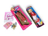 barbie doll in a pink box with a pink dress and accessories