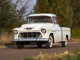 a white truck that is driving down the road
