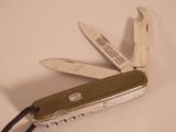 a swiss army knife that is open on the table