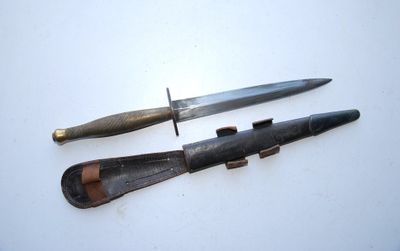 two knives that are laying next to each other on a table