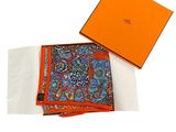 an orange box with a blue and orange paisley pattern on it