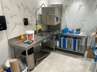 a kitchen with a stainless steel counter and a sink