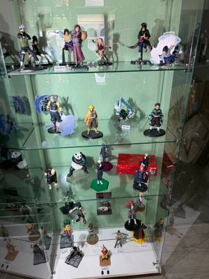 many figurines on display in a glass case