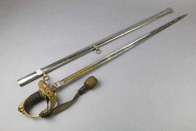 two swords and a sword on a white surface