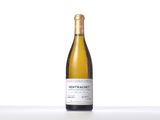 a bottle of white wine sitting on top of a table