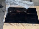 a cardboard box with a piece of black material on it