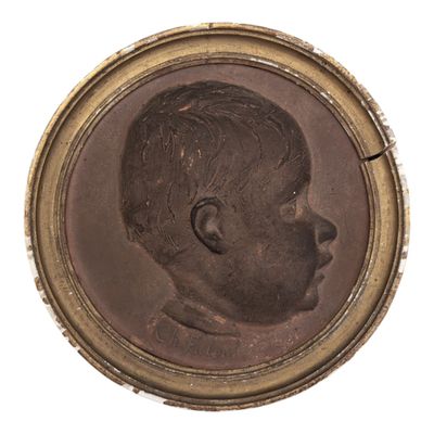 portrait of a young boy in a gold frame on a white background