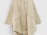 an image of a jacket hanging on a hanger on a wall