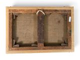 an old wooden frame with two empty canvass hanging from it ' s sides