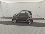 a small car that is parked in a garage