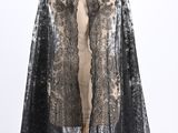 a black and white lace cape on a mannequin mannequin mannequin mannequin mannequin mannequin mannequin mannequin