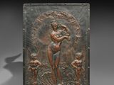 a bronze plaque depicting a woman and two children