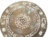 an image of a decorative plate with holes in it