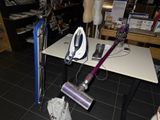 a vacuum that is sitting on a table in a room