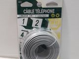 a close up of a package of cable telephone on a white surface
