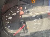 a close up of a car dashboard with a speedometer