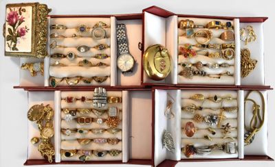 a display case with many different types of jewelry in it