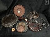 a lot of old metal items on a black cloth