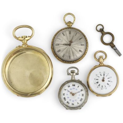 several different types of pocket watches are displayed on a white surface