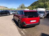 a red car that is parked in a parking lot