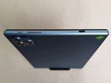 a close up of the back of a cell phone on a table