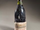 a bottle of wine that is sitting on a table