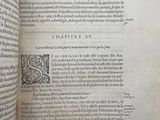 an open book with a picture of a dragon on it