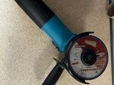 a picture of a cordless sander and other tools on the floor