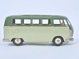 a green and white toy bus on a white surface