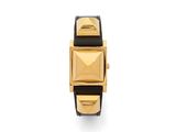 a close up of a gold and black watch on a white background