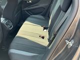 the back seat of a car with a seat belt in the back of it