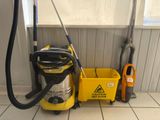a yellow bucket with a vacuum and a yellow bucket with a yellow mop